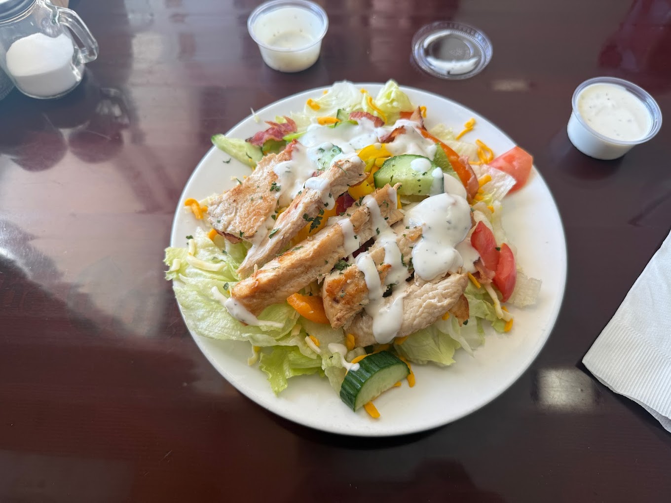 Garden chicken salad with cucumber, tomato, cheese, and ranch dressing